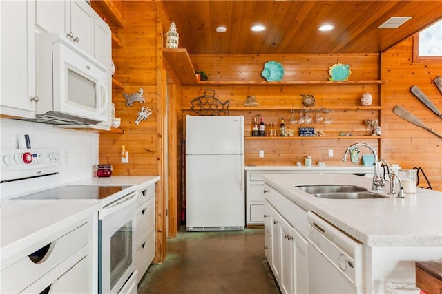 kitchen with white appliances, light countertops, wooden ceiling, and a sink