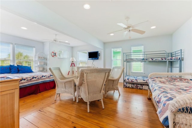 bedroom with recessed lighting, light wood-type flooring, and a ceiling fan