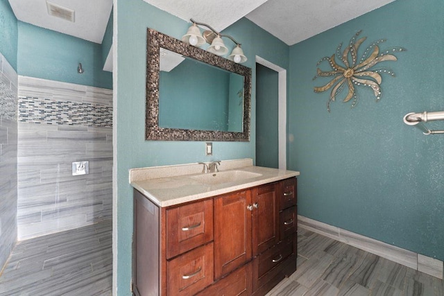 3425 Harold Dr, Corpus Christi, TX 78415 - bathroom with vanity and baseboards