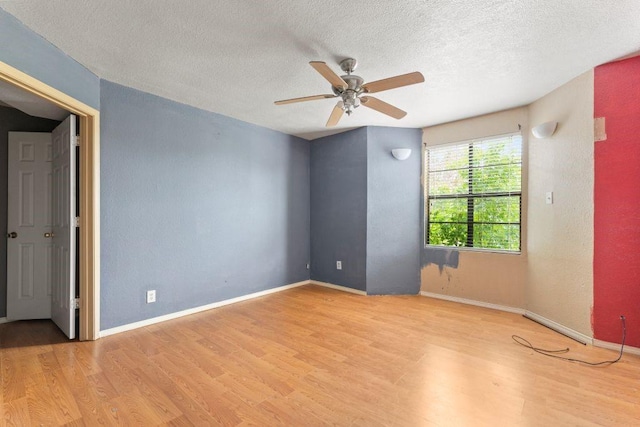 3425 Harold Dr, Corpus Christi, TX 78415 - unfurnished room featuring wood finished floors, a textured ceiling, and ceiling fan
