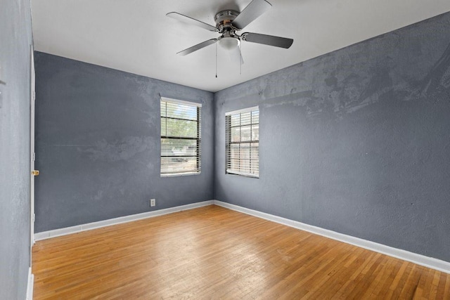 3425 Harold Dr, Corpus Christi, TX 78415 - unfurnished room featuring wood finished floors and ceiling fan