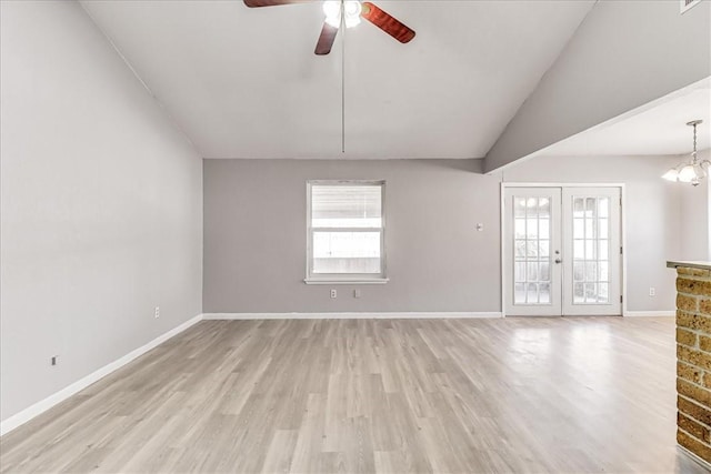 6701 Meadowbreeze Pkwy, Corpus Christi, TX 78414 - unfurnished living room with ceiling fan, light wood-style floors, baseboards, and french doors