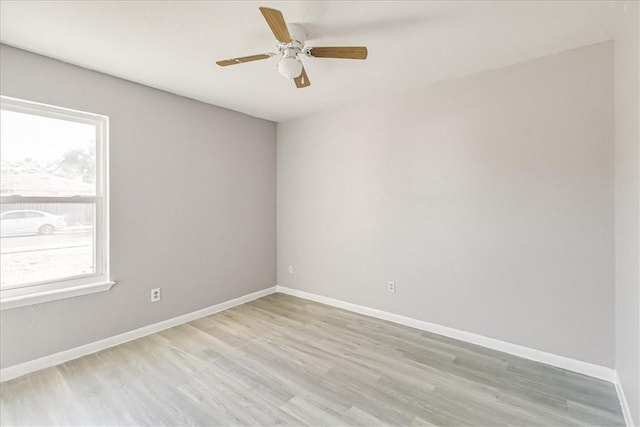 6701 Meadowbreeze Pkwy, Corpus Christi, TX 78414 - unfurnished room featuring light wood-type flooring, baseboards, and ceiling fan