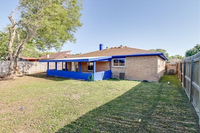 6701 Meadowbreeze Pkwy, Corpus Christi, TX 78414 - rear view of property with brick siding and central AC