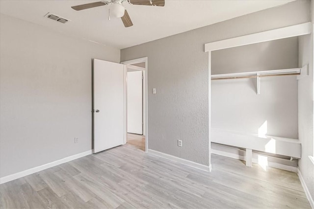 6701 Meadowbreeze Pkwy, Corpus Christi, TX 78414 - unfurnished bedroom featuring wood finished floors, baseboards, and a closet