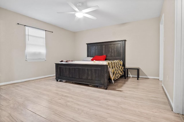 bedroom with ceiling fan and light hardwood / wood-style floors