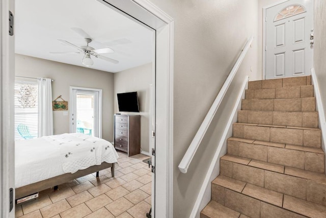 bedroom featuring access to outside and a ceiling fan