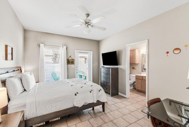 bedroom with ceiling fan, connected bathroom, and light tile patterned floors