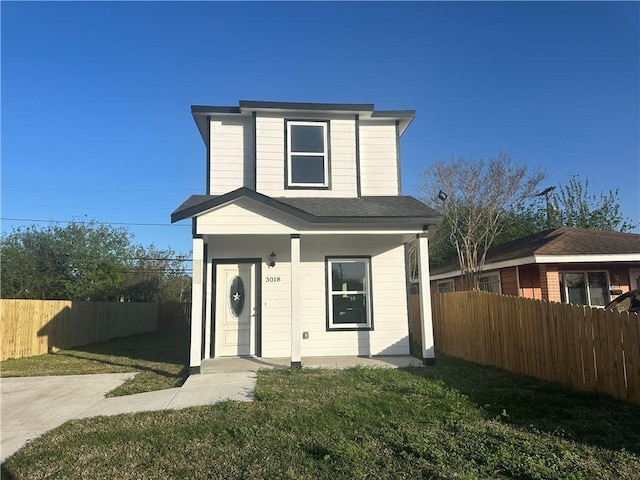 3018 Greenwood Dr, Corpus Christi, TX 78405 - view of front of home featuring a front lawn and fence