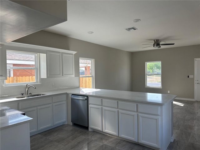3018 Greenwood Dr, Corpus Christi, TX 78405 - kitchen with visible vents, a peninsula, ceiling fan, a sink, and stainless steel dishwasher
