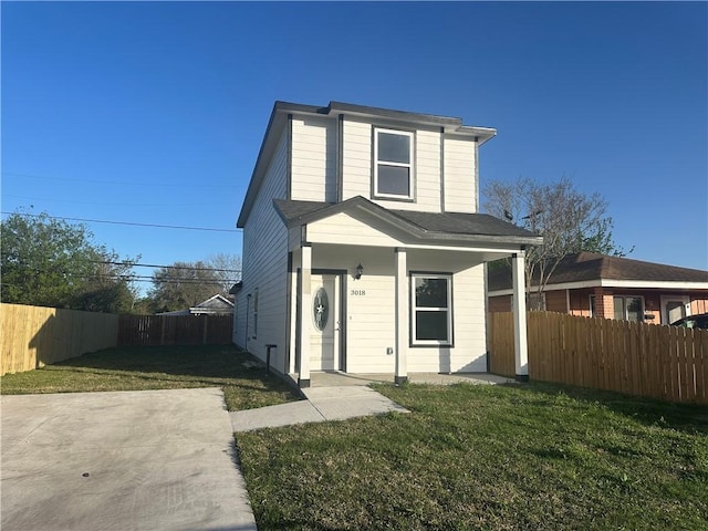 3018 Greenwood Dr, Corpus Christi, TX 78405 - view of front of home with a front yard, covered porch, and fence private yard
