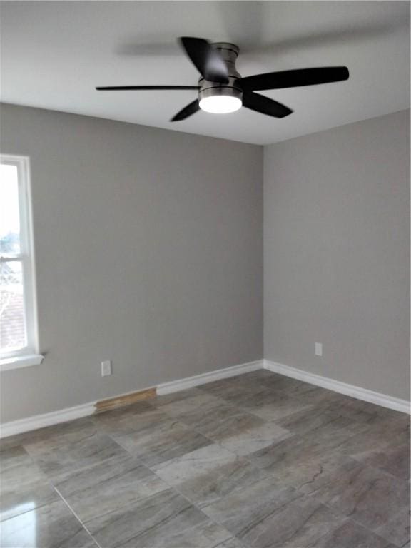 3018 Greenwood Dr, Corpus Christi, TX 78405 - unfurnished room with baseboards and a ceiling fan