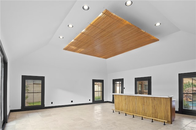 living room featuring high vaulted ceiling