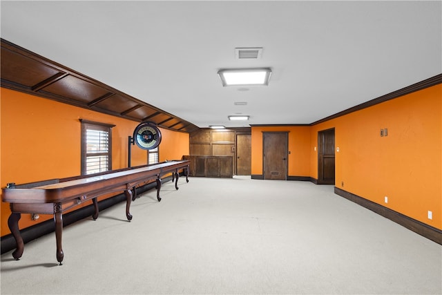 rec room featuring light colored carpet and ornamental molding