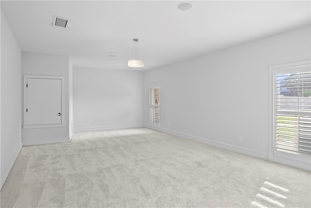 empty room with light colored carpet