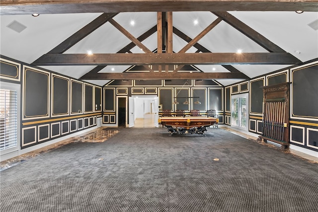 interior space with high vaulted ceiling, carpet floors, and beamed ceiling