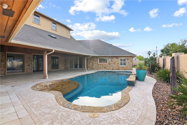 view of swimming pool with a patio