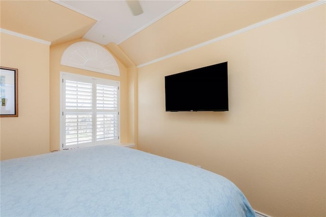 bedroom featuring ceiling fan, ornamental molding, and vaulted ceiling