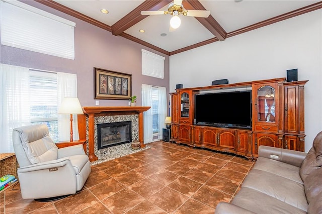 tiled living room featuring a ceiling fan, a towering ceiling, ornamental molding, beam ceiling, and a high end fireplace