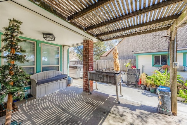 view of patio with fence and a pergola