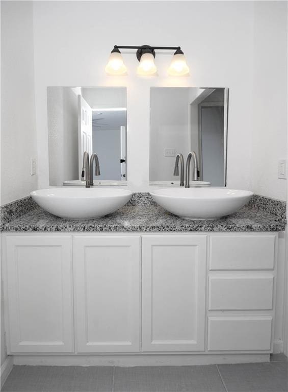 4802 Eider Dr, Corpus Christi, TX 78413 - full bathroom featuring double vanity and tile patterned floors