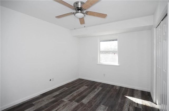 4802 Eider Dr, Corpus Christi, TX 78413 - unfurnished bedroom with a closet, dark wood finished floors, and a ceiling fan