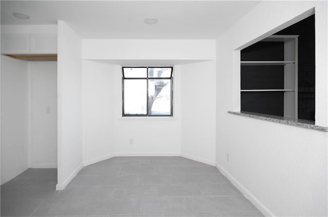 4802 Eider Dr, Corpus Christi, TX 78413 - spare room with light tile patterned flooring and baseboards