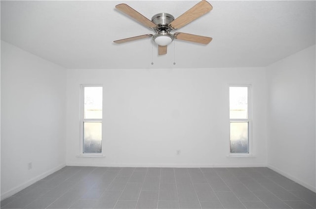 4802 Eider Dr, Corpus Christi, TX 78413 - spare room with plenty of natural light, a ceiling fan, and dark tile patterned flooring