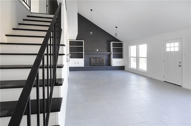 4802 Eider Dr, Corpus Christi, TX 78413 - unfurnished living room featuring high vaulted ceiling, stairs, and a fireplace