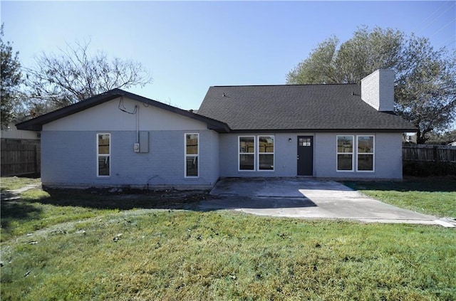 4802 Eider Dr, Corpus Christi, TX 78413 - view of front of home featuring a chimney, brick siding, a patio, and roof with shingles