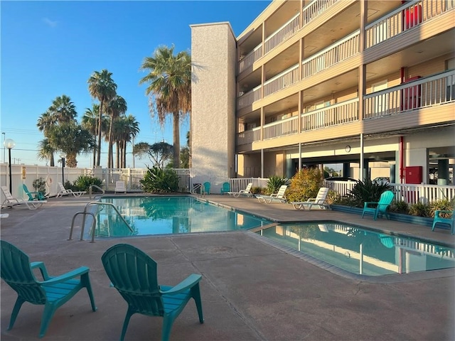 view of swimming pool featuring a patio area