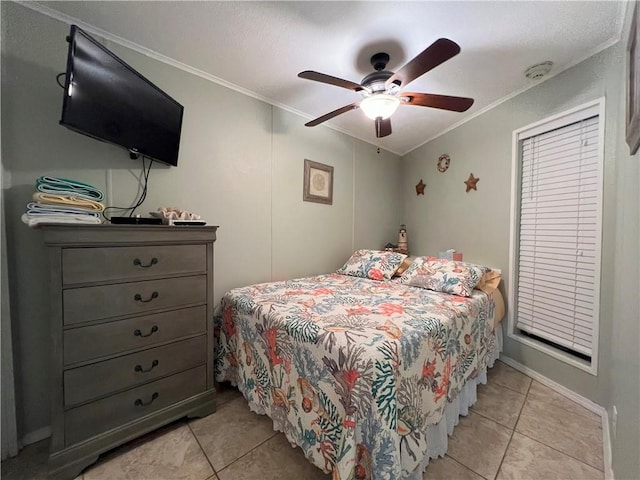 tiled bedroom featuring ceiling fan and ornamental molding