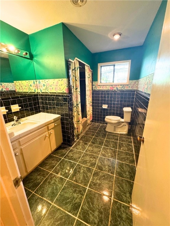 bathroom featuring tile walls, tile patterned flooring, vanity, a shower with curtain, and toilet