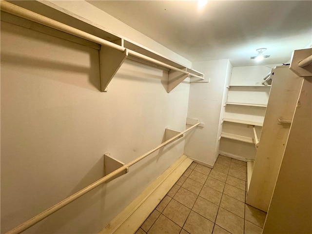 spacious closet featuring light tile patterned floors