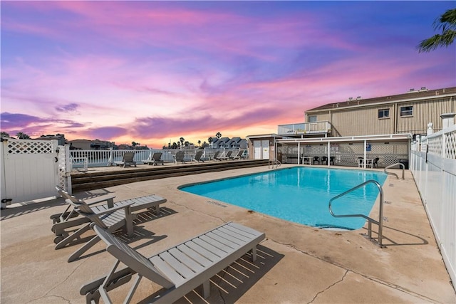 14300 S Padre Island Dr S Unit 220C, Corpus Christi, TX 78418 - pool at dusk featuring a community pool and a patio area