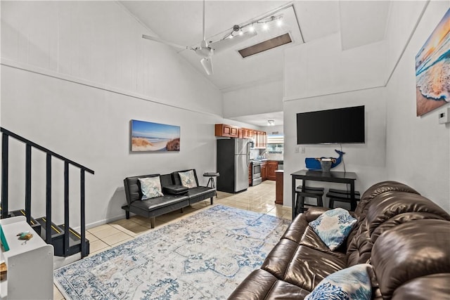 14300 S Padre Island Dr S Unit 220C, Corpus Christi, TX 78418 - living room featuring light tile patterned flooring, high vaulted ceiling, and stairway