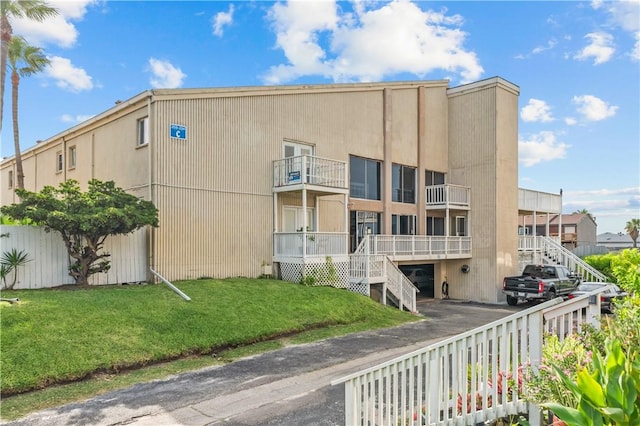 14300 S Padre Island Dr S Unit 220C, Corpus Christi, TX 78418 - view of property featuring driveway and a garage