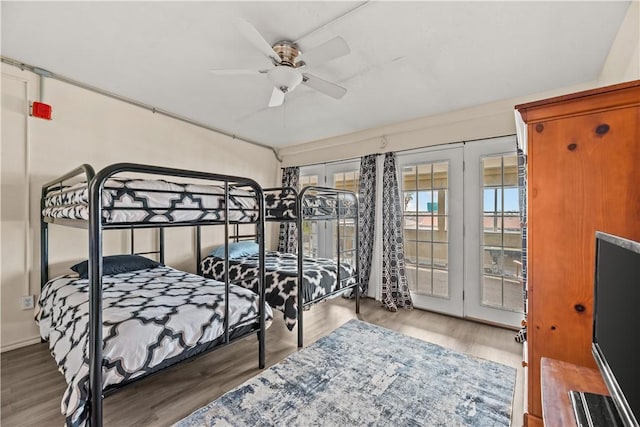14300 S Padre Island Dr S Unit 220C, Corpus Christi, TX 78418 - bedroom with access to outside, wood finished floors, and a ceiling fan