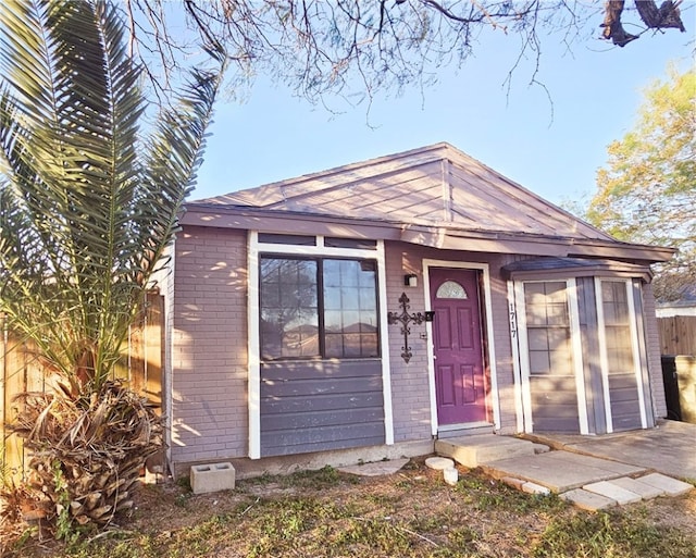 view of front of home with brick siding