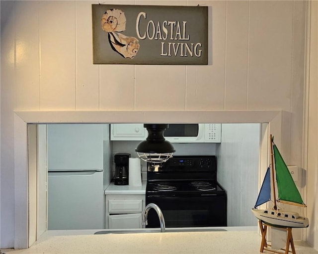 kitchen featuring white appliances and sink