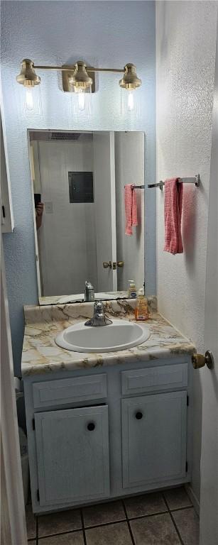 bathroom with vanity and tile patterned floors