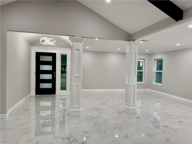 foyer with high vaulted ceiling, a chandelier, and ornate columns