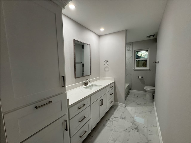 bathroom featuring vanity and toilet