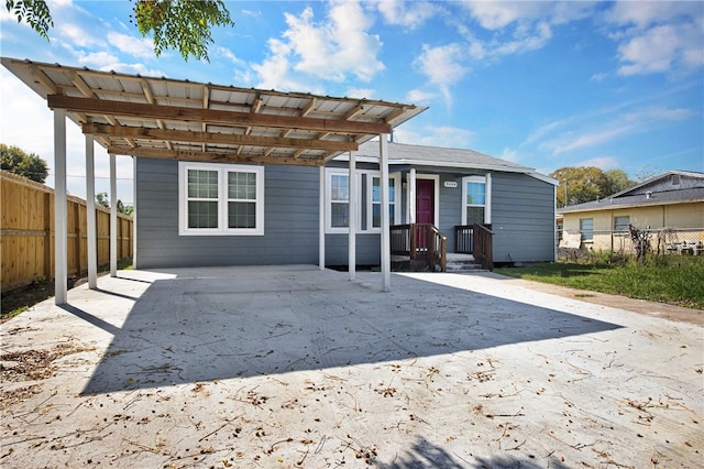 back of property featuring a carport