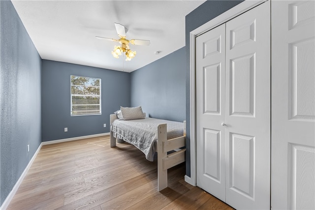 bedroom with ceiling fan and light hardwood / wood-style flooring