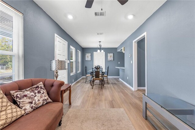 3609 Stinson St, Corpus Christi, TX 78405 - dining room with light wood finished floors, a ceiling fan, and baseboards