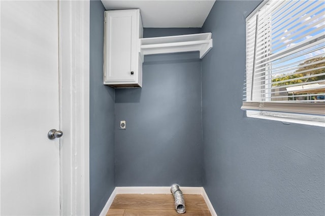 3609 Stinson St, Corpus Christi, TX 78405 - laundry room with cabinet space, hookup for an electric dryer, and baseboards