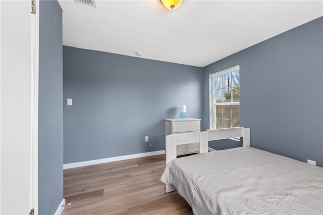 bedroom with light hardwood / wood-style flooring