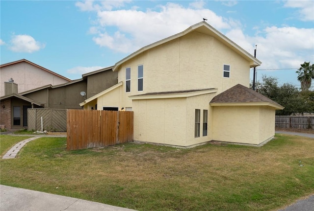 view of side of property featuring a yard