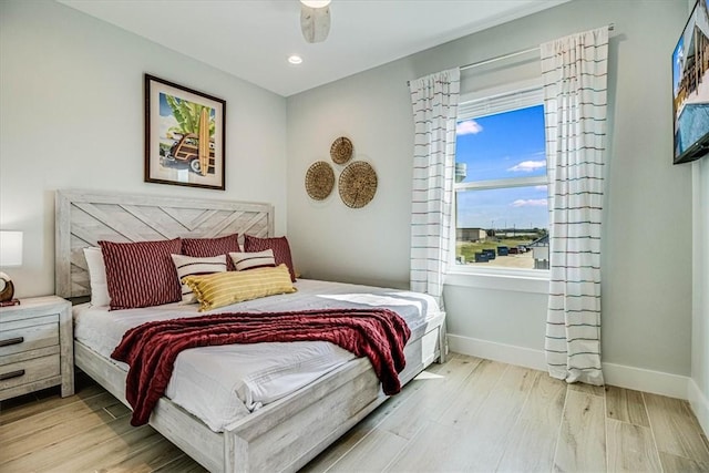 1901 Eskridge Rd, Port Aransas, TX 78373 - bedroom featuring wood finished floors, baseboards, recessed lighting, and ceiling fan